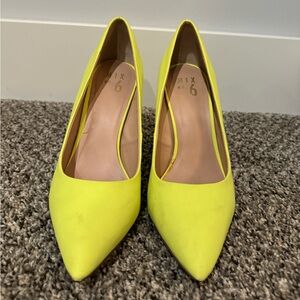 Neon yellow pump heels